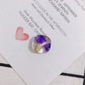 Detailed macro view of a square clear resin pendant with embedded purple dried flowers - Purple Dried Flower Style (4#)