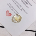 Detailed macro view of a translucent resin square pendant with embedded yellow dried flowers - Yellow Dried Flower Style (5#)