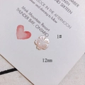 Detailed view of a 12mm carved pink shell flower bead for DIY jewelry making - Pinkish White Five-Petal Flower Style (1#)