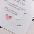 Macro view of 12mm white shell flower bead for DIY jewelry and hair accessories - 12mm Pearly Luster Flower Style (11#)