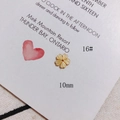 Detailed macro view of 10mm yellow shell cherry blossom charms for DIY jewelry making - Light Yellow Five-Petal Carved Flower Style (16#)