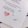 Macro view of a 10mm white shell flower bead with iridescent luster for DIY jewelry - 10mm Natural White 5-Petal Style (17#)