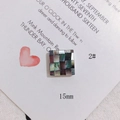 Macro shot of 15mm square shell pendant with iridescent purple and green textures - Iridescent Dark Square Mosaic Splicing (2#)
