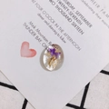 Macro detail of oval acrylic pendant with purple dried flowers and gold leaf foil inside - Purple Flower Style (1#)