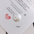 Macro shot of 18mm round natural shell mosaic pieces with a white checkerboard pattern - Creamy White Checkered Round Disc (9#)