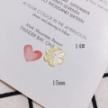 Dettaglio perla a forma di fiore in madreperla da 15mm per gioielli fai-da-te lucidi - Petali Lucentezza Perla Bianco e Giallo (14#)