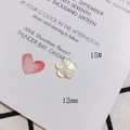 Macro di una perlina a fiore in madreperla da 12mm per la creazione di gioielli - Accessorio Forma di Fiore a Cinque Petali Bianco Sporco (15#)