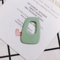 Macro shot of mint green irregular acrylic pendant for DIY jewelry and earrings - Greyish Green