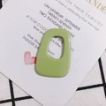 Macro view of avocado green irregular rectangular acrylic pendant for DIY jewelry - Fruit Green