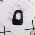 Macro view of a glossy black irregular hollow acrylic trapezoid for DIY jewelry making - 8# Black