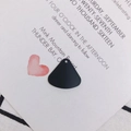 Matte black fan-shaped alloy pendant for DIY earrings on a decorative white card - Black