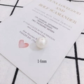 Detail shot of a 14mm white pearlescent bead with a glossy finish for DIY jewelry - Pearlescent Spherical Bead(3#)