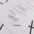 Macro view of a 15x12mm baroque pearl with iridescent luster and natural texture - Flat Round Irregular Style (7#)