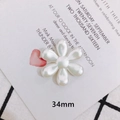 Close-up of a 34mm white pearl luster flower charm for DIY handmade jewelry and hair accessories - Six-Petal Flower (1)