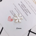 Detailed view of a 25mm cream pearl flower charm for DIY jewelry and hair accessories - Rounded Six-Petal Flower (2)