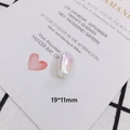 Close-up of a 19x11mm pearlescent irregular faux pearl bead with iridescent finish - Oval Pearlescent Style (10#)