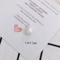 Macro shot of a 14x11mm white baroque pearl bead with a lustrous iridescent finish - Iridescent Irregular Loose Bead(12#)