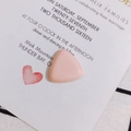 Detailed macro view of a peach pink triangle resin piece for DIY jewelry and crafts - Pink
