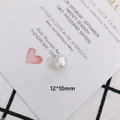 Macro shot of 12x10mm baroque pearl bead showing smooth white luster and oval shape - Oval Baroque Pearl (10)