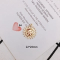 Detail of a 22x20mm gold sun face pendant for DIY jewelry making with relief texture - Sun God Mask Motif Style (KP3108)