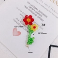 Macro detail of handmade beaded flower charms for DIY jewelry crafting in red and yellow - Two-Tone Flower Cluster Style (7#)
