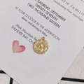 Close-up of 18K gold plated Scorpio zodiac coin pendant for DIY jewelry making - Capricorn