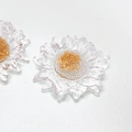 Close-up of resin daisy flower charms with gold glitter center for DIY jewelry making - 3D Floral / White Daisy