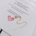 Detail of gold star drop earrings with sparkling cubic zirconia on a white card - Hexagonal Star (1)