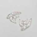 Macro shot of iridescent resin swallow charms with detailed feather texture for DIY jewelry - Swallow Shape / Iridescent Aurora
