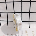 Macro view of 0.3mm silver plated copper wire spool for DIY jewelry handcrafting - 0.2mm x 24m / Silver