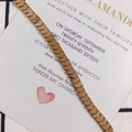 Close-up of golden chevron chain links on a wedding invitation and checkered fabric - String (Approx 114 Units) / Bronze
