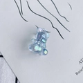Transparent blue laser-coated resin bear pendant with colorful iridescent gradient finish - Iridescent Blue
