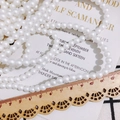 Perline bianche verniciate per gioielli fai-da-te su sfondo vintage con righello - 6mm / Perlina Color Caramello (KP2917-5) / Bianco Lucido