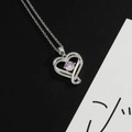 Heart pendant necklace in silver finish with a centered light pink birthstone gem - Light Purple (June)