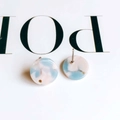 Macro view of round resin earrings featuring blue and pink marble texture with steel pins - 11# (Blue Pink White Marble)
