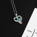 Heart pendant necklace in silver finish featuring a floating sky blue round gemstone - Sky Blue (December)