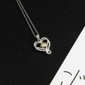 Stainless steel heart pendant necklace with bright yellow zircon and silver chain - Peridot Green (August)