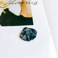 Macro detail of blue and white marble pattern resin flower charms for DIY jewelry making - Blue White Floral Marbled (5#)