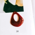 Macro view of dark red resin teardrop pendant with smooth translucent finish - Dark Red Amber Pattern (1#)