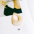 Detail view of a cream-colored resin water drop pendant with a hollow center for DIY jewelry - Cream (9#)