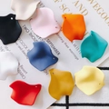 Flat lay of colorful resin petal charms with smooth matte finish for DIY jewelry making - Mixed