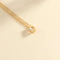Elegante collana placcata in oro con ciondolo in zircone trasparente a goccia su catena fine - Oro-Aprile