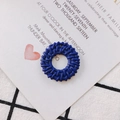 Detail of dark blue hollow round woven rattan accessory with a small connector hole - Navy Blue