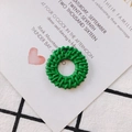 Detail of bright green woven round pendant with hollow texture and hanging hole - Grass Green