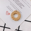 Macro shot of natural woven rattan circular DIY earring component with thread hole - Beige