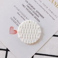Detailed view of a white round resin pendant with intricate woven texture and small hole - 1# Pearl White Shell