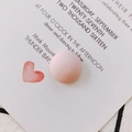 Macro shot of a matte pink resin dome charm for DIY shoe and accessory crafts - Pink