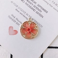 Ethnic round embroidery pendant in orange silk thread with gold petal metal frame - Orange