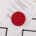 Macro shot of red round resin pendant with woven texture for DIY jewelry making - Red