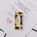 Close-up of leopard print rectangular pendant with a gold rope-textured metal frame - Ginger Yellow Leopard (2#)